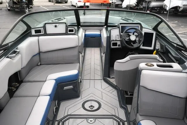 Slide: The Image of 2019 Supra SE 450 boat interior with modern seating and advanced dashboard controls. - 7