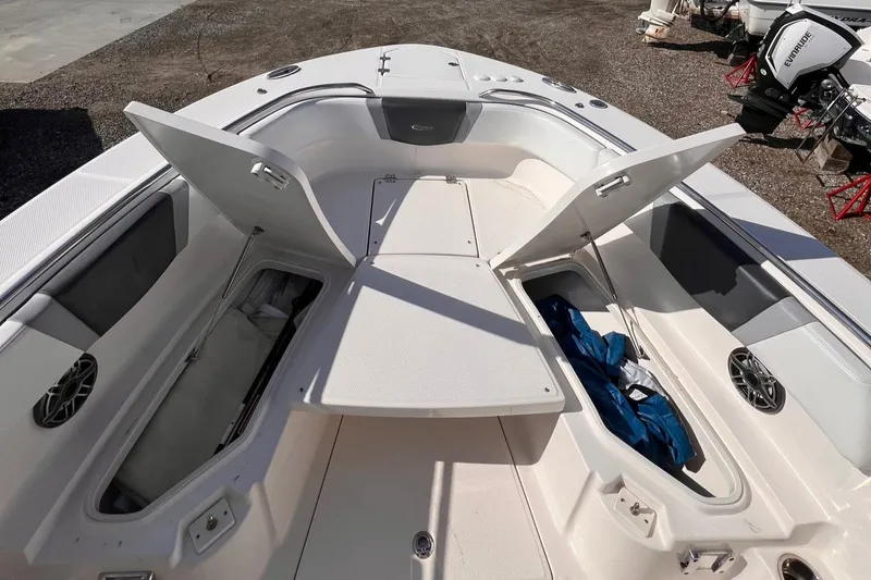 Slide: The Image of 2020 Robalo R272 Center Console boat with open storage compartments. - 3