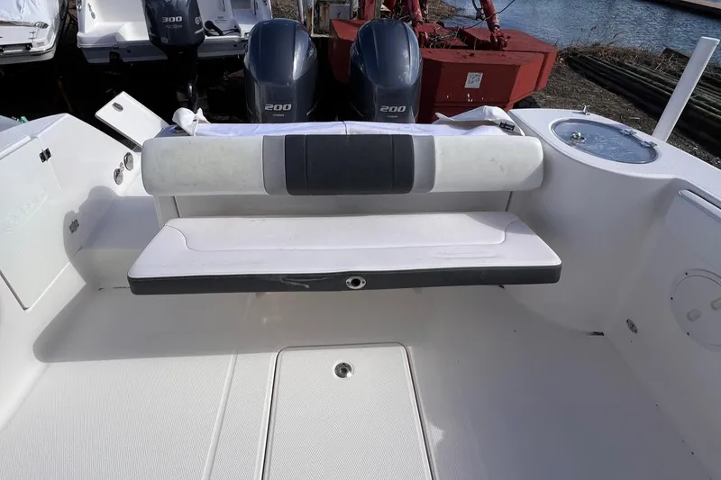 Slide: The Image of 2020 Robalo R272 Center Console boat interior with seating and dual engines. - 6