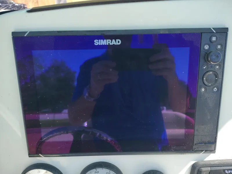 Slide: The Image of Simrad display on 2021 NauticStar 2302 Legacy boat dashboard. - 26