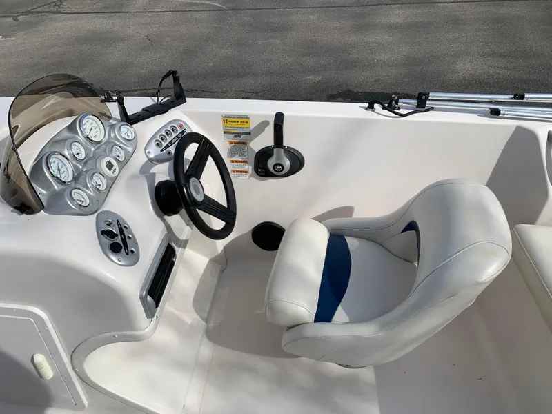 Slide: The Image of 2006 Starcraft SeaStar 2000 boat interior with steering wheel and gauges. - 4