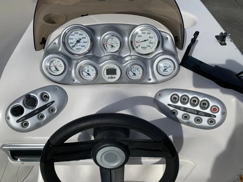 Slide: The Image of Dashboard of a 2006 Starcraft SeaStar 2000 boat with gauges and controls. - 5