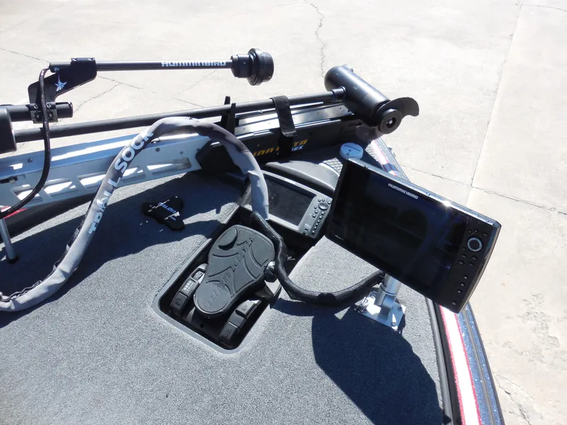 Slide: The Image of 2013 Triton 21XS DC boat dashboard with electronic controls and display. - 10