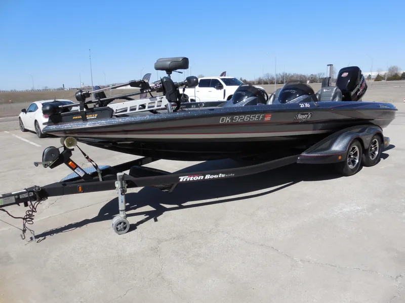 Slide: The Image of 2013 Triton 21XS DC boat on trailer in parking lot. - 6