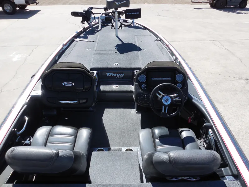 Slide: The Image of 2013 Triton 21XS DC boat interior with dual consoles and seating. - 7