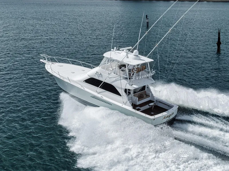 The Image of 2009 Viking 54 Convertible yacht cruising on open water. - 1