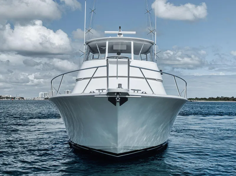 Slide: The Image of Front view of a 2009 Viking 54 Convertible yacht on the water. - 10