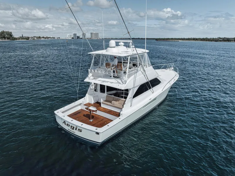Slide: The Image of 2009 Viking 54 Convertible yacht cruising on open water. - 15