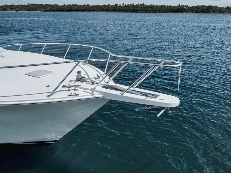 Slide: The Image of 2009 Viking 54 Convertible yacht bow on calm water. - 22