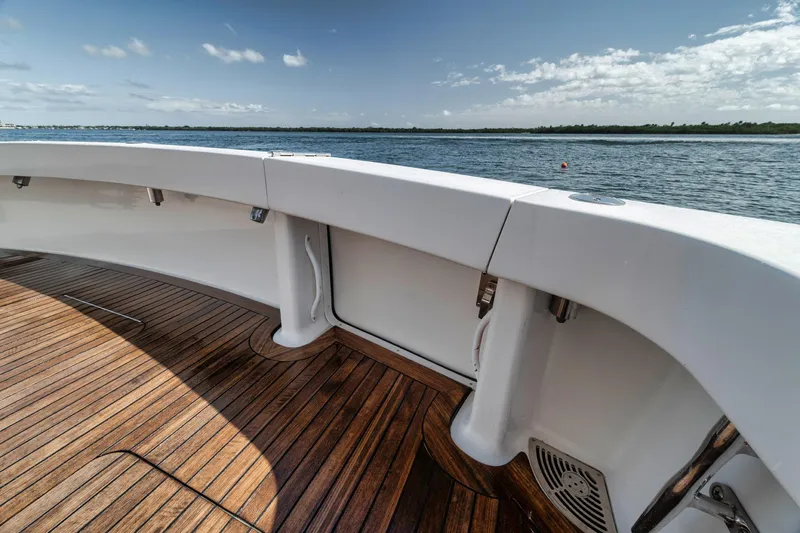 Slide: The Image of 2009 Viking 54 Convertible yacht deck with ocean view and wooden flooring. - 23