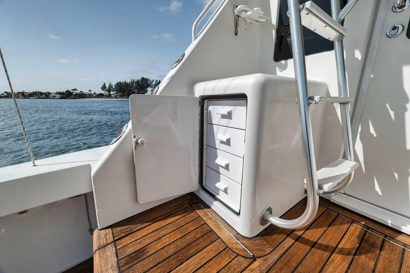 Slide: The Image of 2009 Viking 54 Convertible yacht with open storage compartment on deck. - 26