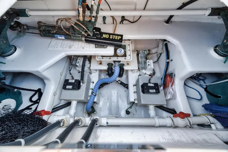 Slide: The Image of Engine room of 2009 Viking 54 Convertible yacht, showcasing mechanical components and wiring. - 28