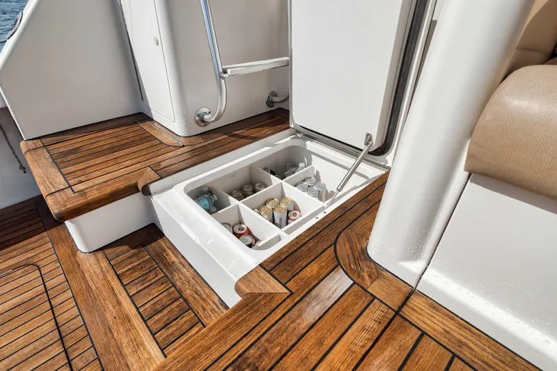 Slide: The Image of Built-in cooler on 2009 Viking 54 Convertible yacht with wooden deck. - 29