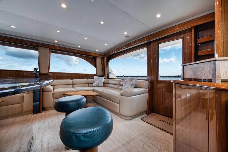 Slide: The Image of Luxurious interior of 2009 Viking 54 Convertible yacht with plush seating and elegant wood finishes. - 34