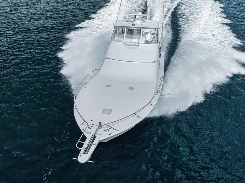 Slide: The Image of Viking 54 Convertible 2009 yacht cruising on open water, aerial view. - 4
