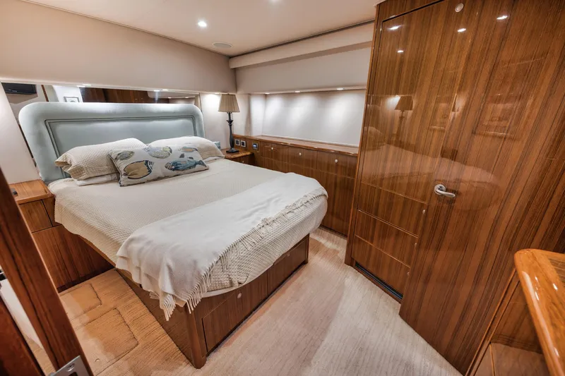 Slide: The Image of Luxurious bedroom interior of 2009 Viking 54 Convertible yacht with elegant wood finishes. - 40
