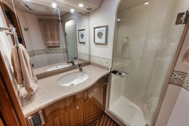Slide: The Image of Luxurious bathroom in 2009 Viking 54 Convertible yacht with modern fixtures and elegant design. - 41