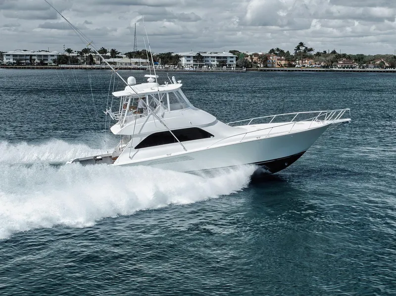 Slide: The Image of 2009 Viking 54 Convertible yacht cruising on open water. - 5