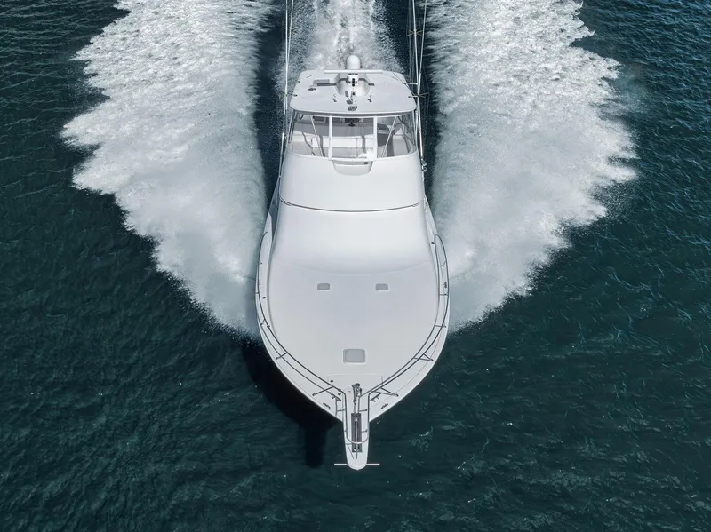 Slide: The Image of 2009 Viking 54 Convertible yacht cruising on open water, aerial view. - 7