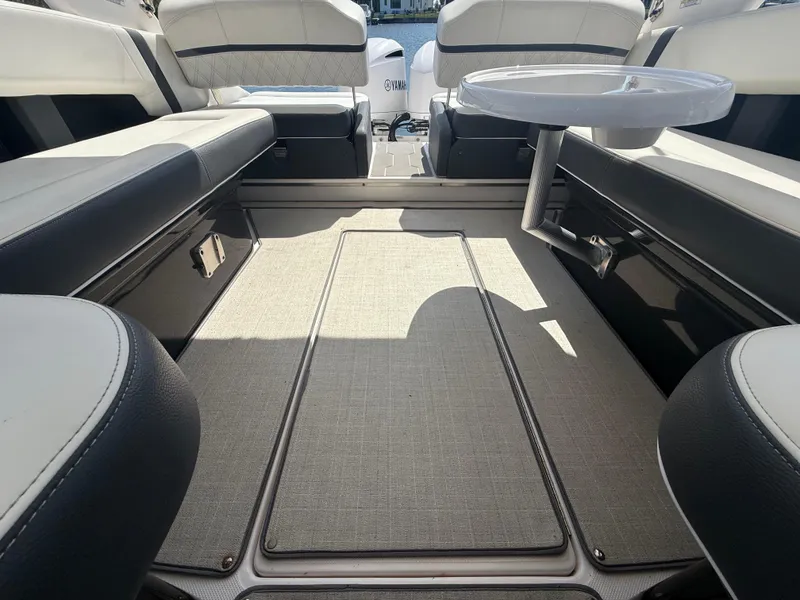 Slide: The Image of 2020 Regal 29 OBX boat interior with seating and table, showcasing luxury design. - 30