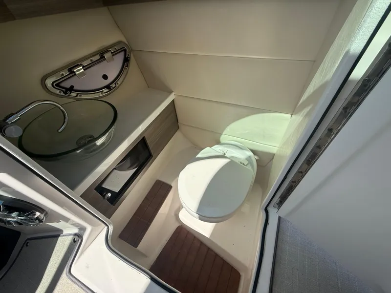 Slide: The Image of 2020 Regal 29 OBX boat interior bathroom with modern sink and toilet. - 41