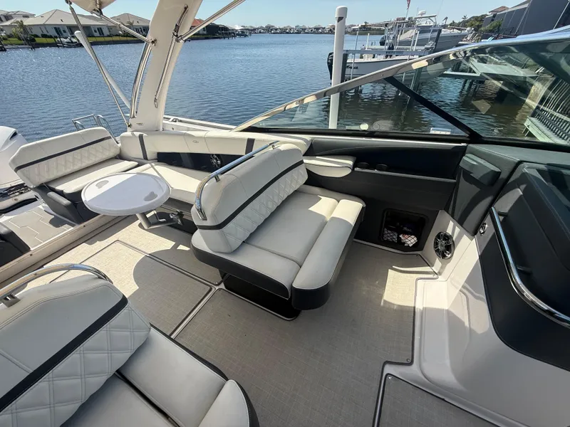 Slide: The Image of Luxurious interior of 2020 Regal 29 OBX boat with comfortable seating and scenic water view. - 25