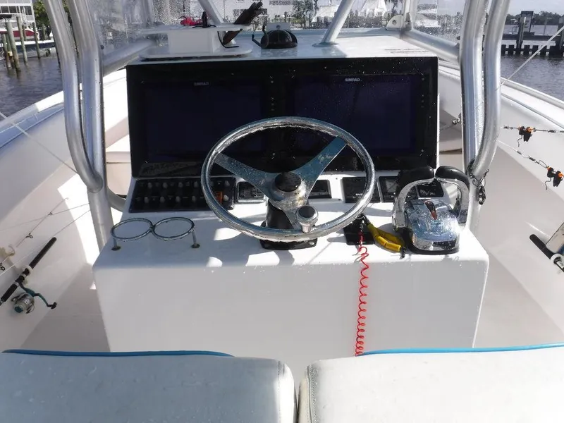 Slide: The Image of Cockpit of 2017 Dusky 33 Tournament boat with steering wheel and controls. - 11