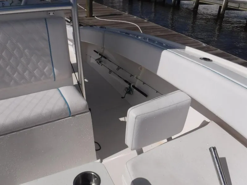 Slide: The Image of Interior of 2017 Dusky 33 Tournament boat with rod holders and seating. - 16