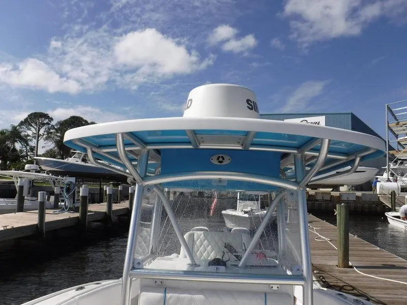 Slide: The Image of 2017 Dusky 33 Tournament boat docked under clear blue sky. - 18