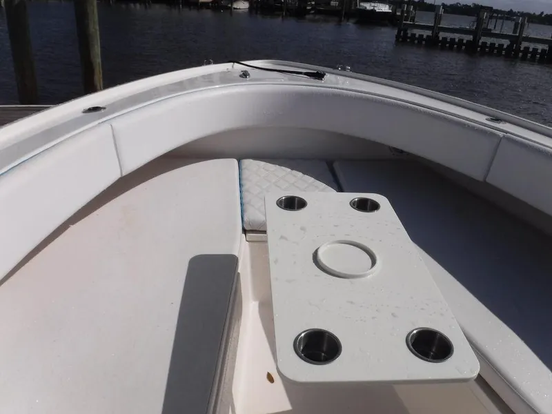 Slide: The Image of 2017 Dusky 33 Tournament boat interior with seating and cup holders. - 19