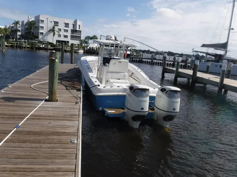 Slide: The Image of Dusky 33 Tournament 2017 boat docked at marina with twin engines. - 3