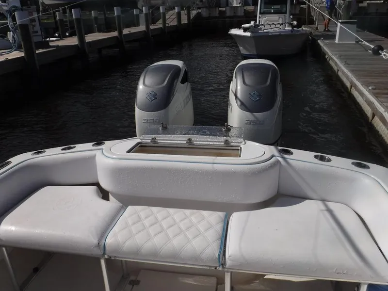 Slide: The Image of 2017 Dusky 33 Tournament boat with dual engines docked at marina. - 5