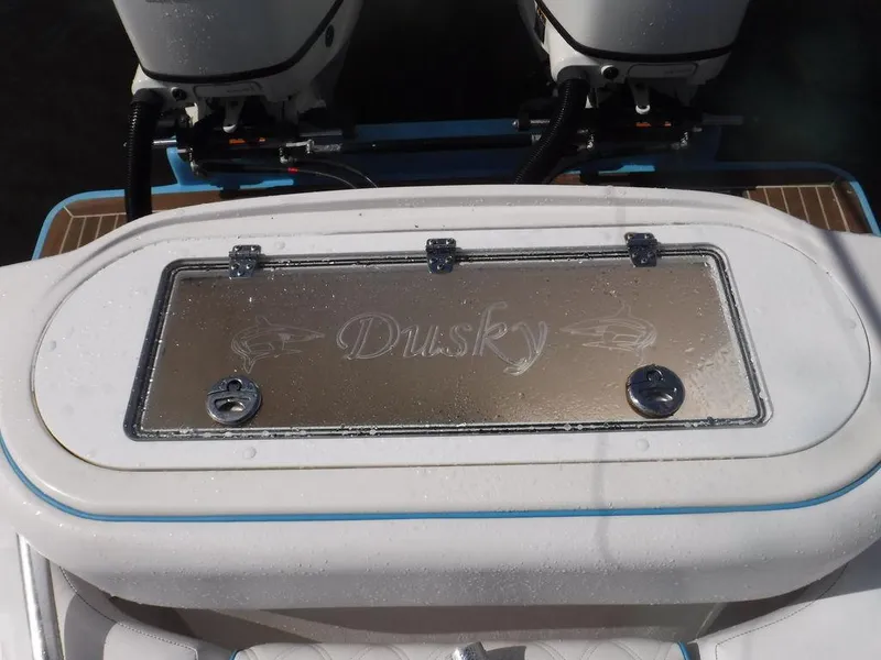 Slide: The Image of 2017 Dusky 33 Tournament boat with dual engines and branded hatch cover. - 7