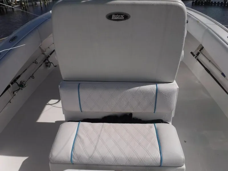Slide: The Image of Dusky 33 Tournament 2017 boat seating with white cushions and blue accents. - 8