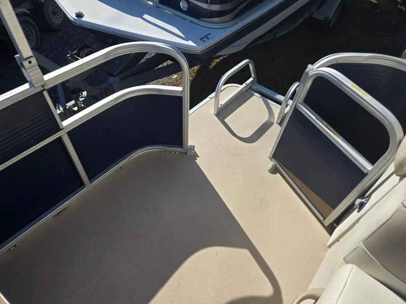 Slide: The Image of 2014 Sweetwater 2086 pontoon boat deck with railing and entry gate. - 17