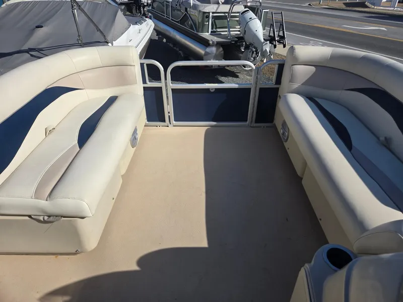 Slide: The Image of Interior of a 2014 Sweetwater 2086 pontoon boat with beige seating. - 22