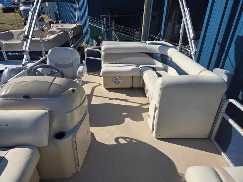 Slide: The Image of 2014 Sweetwater 2086 pontoon boat with beige seating and steering console. - 6