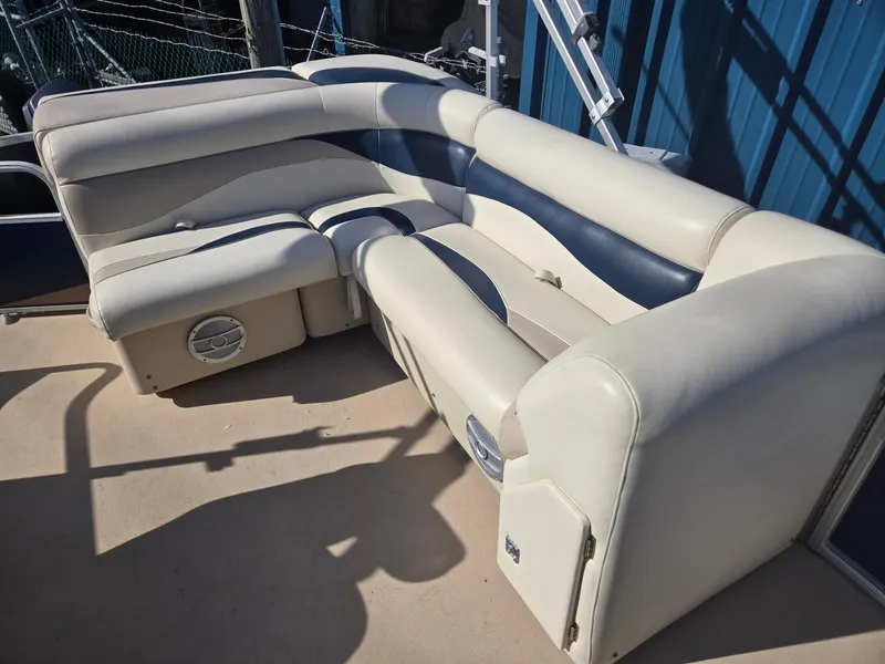 Slide: The Image of 2014 Sweetwater 2086 boat seating with beige and blue upholstery. - 9