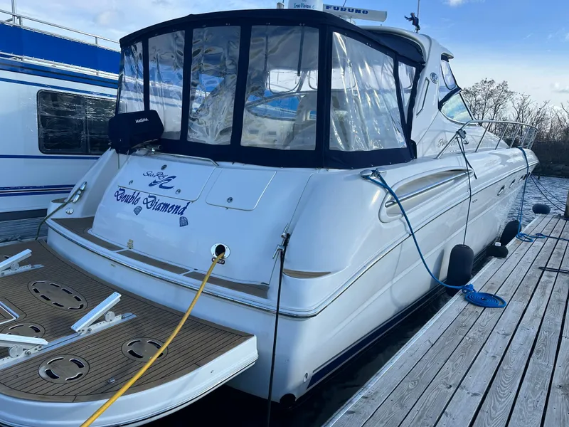 The Image of 2002 Sea Ray 510 Sundancer docked, featuring a sleek design and spacious deck area. - 0