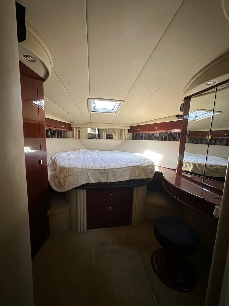 Slide: The Image of Luxurious cabin interior of 2002 Sea Ray 510 Sundancer yacht with bed and vanity. - 10