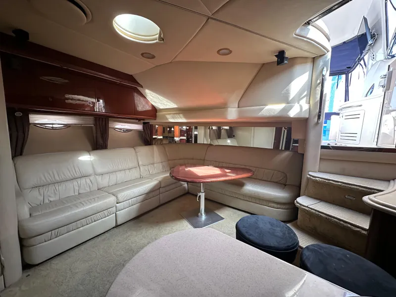 Slide: The Image of Luxurious interior of 2002 Sea Ray 510 Sundancer yacht with plush seating and elegant design. - 11