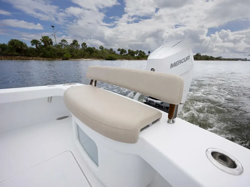 Slide: The Image of 2024 Xcelerator Boatworks 26 with Mercury engine on a scenic waterway. - 33