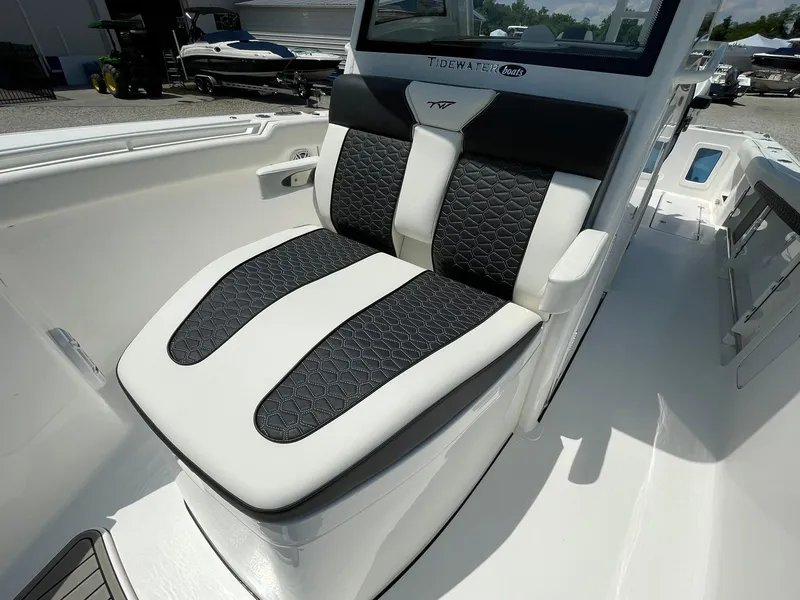 Slide: The Image of 2026 Tidewater 302 CC Adventure boat seat with black and white upholstery. - 14