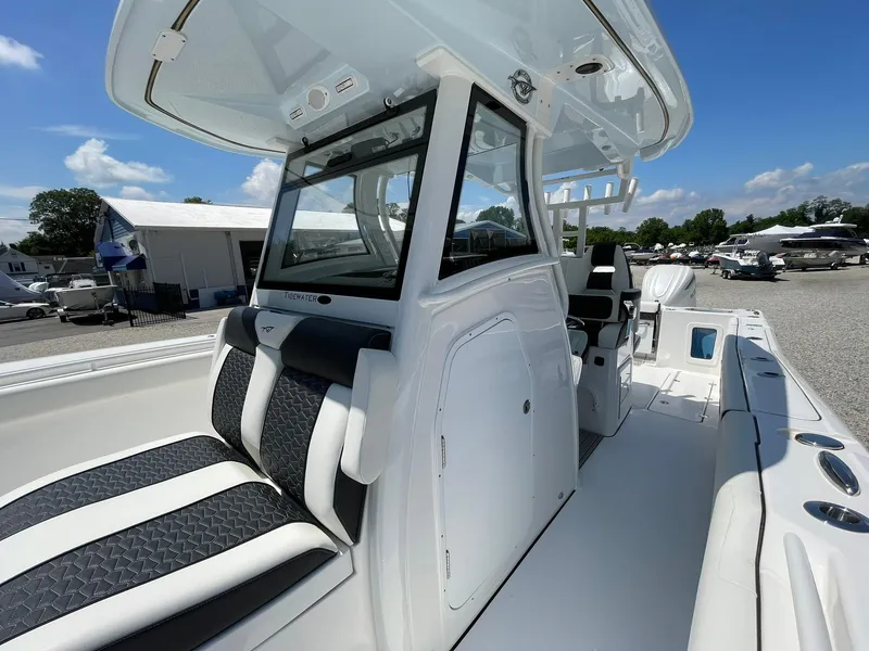 Slide: The Image of 2026 Tidewater 302 CC Adventure boat interior with sleek seating and modern design. - 26
