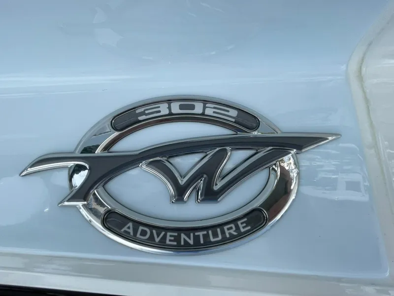 Slide: The Image of 2026 Tidewater 302 CC Adventure logo on a sleek white surface. - 4