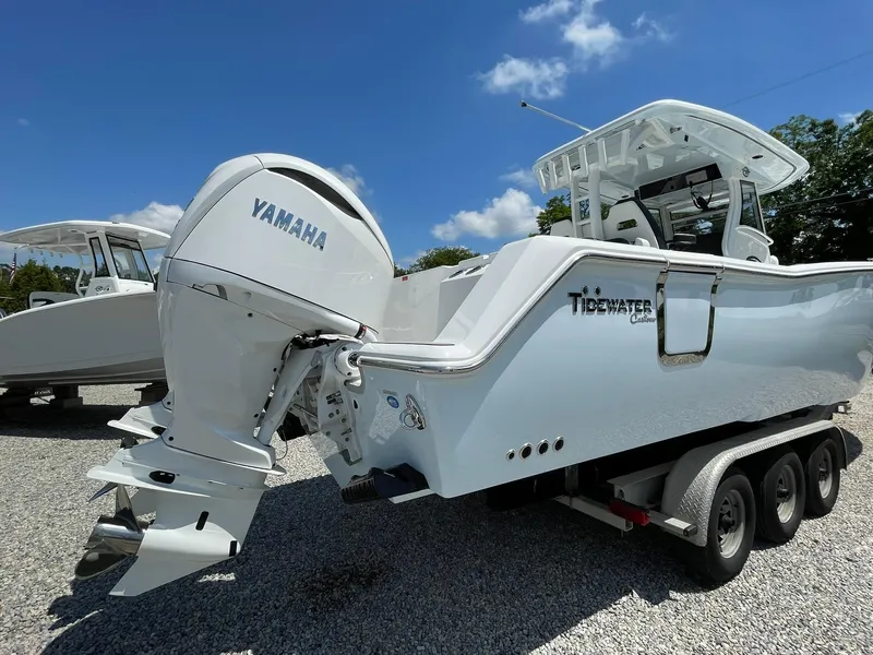 Slide: The Image of 2026 Tidewater 302 CC Adventure boat with Yamaha engine on a trailer. - 73