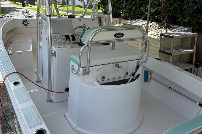 Slide: The Image of 2023 Dusky 252 boat interior with helm station and seating. - 15