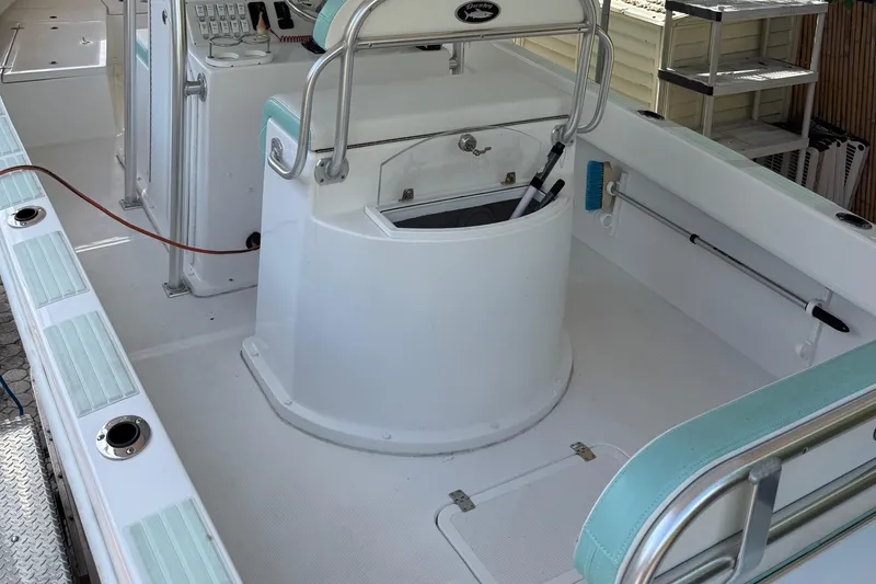 Slide: The Image of 2023 Dusky 252 boat interior with helm station and seating. - 16