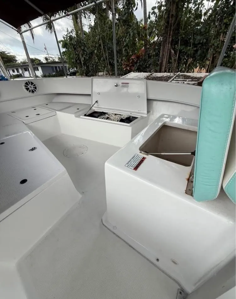 Slide: The Image of 2023 Dusky 252 boat interior with seating and storage compartments. - 9