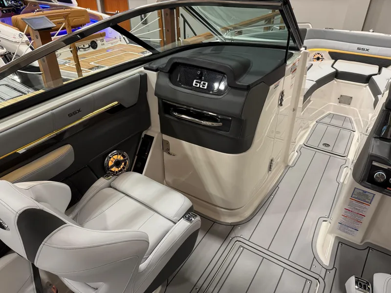 Slide: The Image of 2025 Chaparral 2870 SSX boat deck with sleek gray design and integrated speakers. - 10